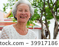 Older Asian women with grayish hair have smiling  39917186