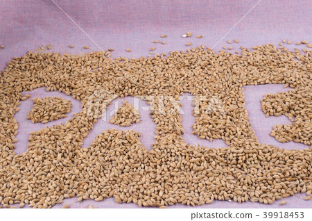 inscription pale with malt grains on lilac textile 39918453