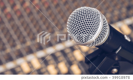 microphone on audio mixing board background microphone on audio mixing board background 39918978