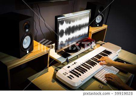 composer working in editing & recording studio composer working in editing & recording studio 39919028