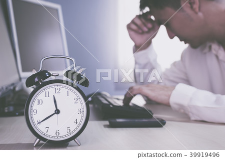 tired and sick asian businessman work overtime tired and sick asian businessman work overtime 39919496