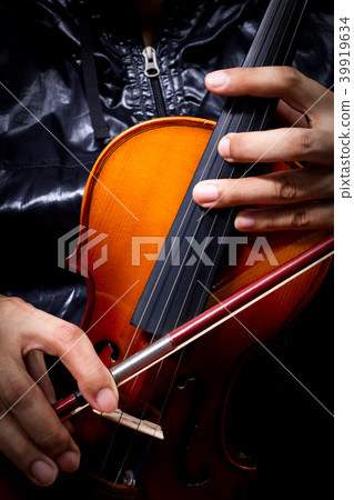musician in black jacket playing classical violin musician in black jacket playing classical violin 39919634