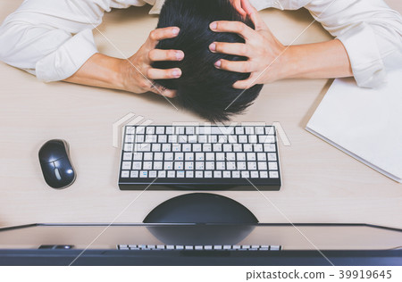 Tired & headache asian businessman work overtime 39919645