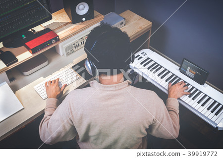 music composer making songs in recording studio 39919772
