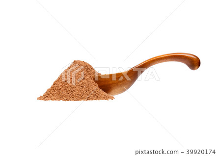 Nutmeg powder in the wooden spoon, isolated on white background. Nutmeg powder in the wooden spoon, isolated on white background. 39920174