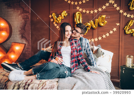 Couple hugs on the bed in bedroom with decoration 39920993
