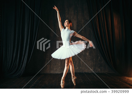 Graceful ballerina dancing in ballet class Graceful ballerina dancing in ballet class 39920999