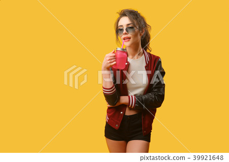 Woman in stylish jacket with drinking jar Woman in stylish jacket with drinking jar 39921648