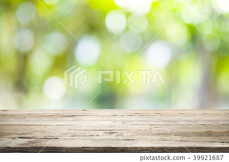 Wooden table with blur background of nature forest Wooden table with blur background of nature forest 39921687