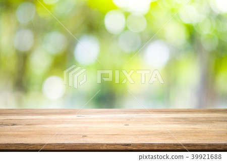 Wooden table with blur background of nature forest Wooden table with blur background of nature forest 39921688