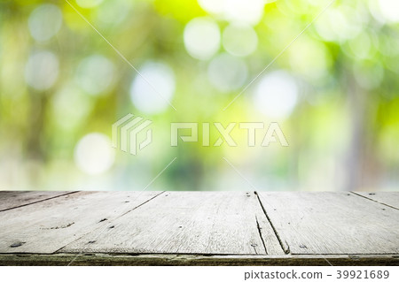 Wooden table with blur background of nature forest Wooden table with blur background of nature forest 39921689