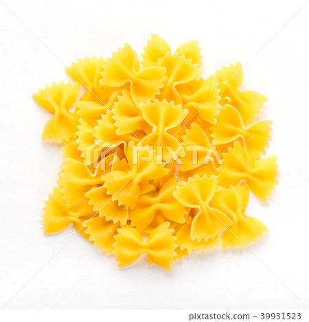 farfalle macaroni background with pasta on white isolated background with shadow. A view from the farfalle macaroni background with pasta on white isolated background with shadow. A view from the 39931523