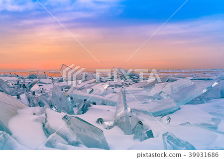 Cracking Ice in Baikal water lake with sunrise Cracking Ice in Baikal water lake with sunrise 39931686