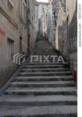Old stone stairs on the street in Blato, Croatia 39931947
