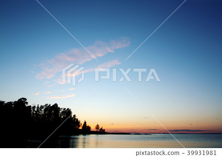 Beautiful sunset. Russian North. Lake and trees. 39931981