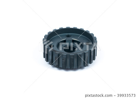 Close-up of a crankshaft gear on an isolated white background. New spare parts 39933573