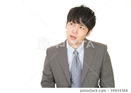 與一個疲乏的表示的一個商人 與一個疲乏的表示的一個商人 39934366