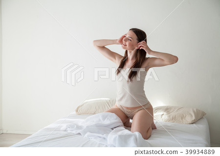 girl in lingerie woke up in the morning in the bedroom 39934889