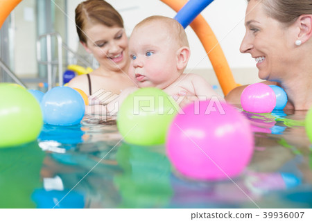 Mums and babies having fun at infant swimming Mums and babies having fun at infant swimming 39936007
