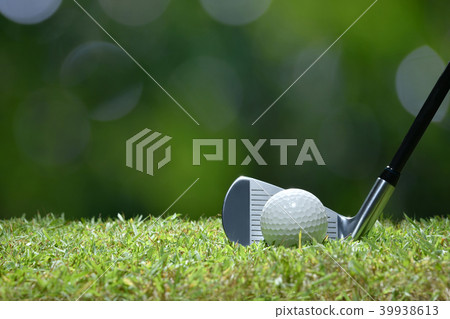 Golf ball on green grass ready to be struck 39938613