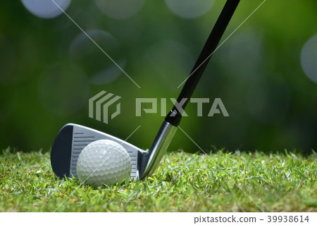 Golf ball on green grass ready to be struck 39938614