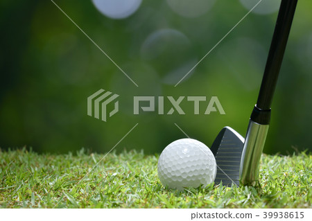 Golf ball on green grass ready to be struck Golf ball on green grass ready to be struck 39938615