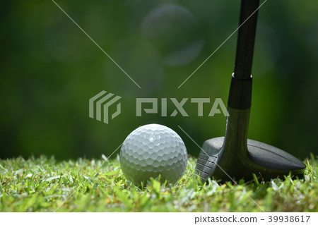 Golf ball on green grass ready to be struck 39938617