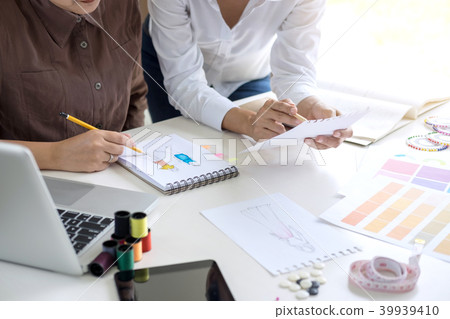 Two professional stylish fashion designer working as fashion des 39939410