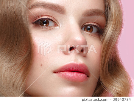 Beautiful girl with light make-up and gentle manicure in blue clothes. Beauty face. Design nails. Beautiful girl with light make-up and gentle manicure in blue clothes. Beauty face. Design nails. 39940784