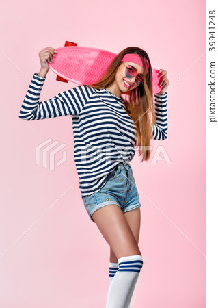 beautiful woman with skate in studio 39941248