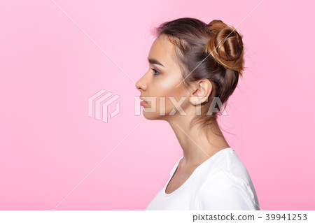 young woman on pink background Attractive beautiful woman showing air kiss 39941253