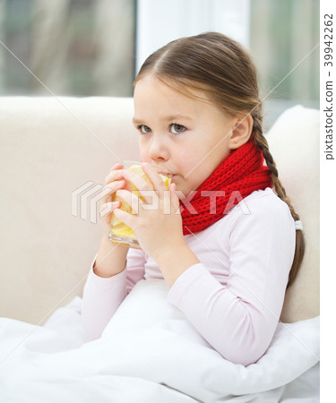 Ill little girl is drinking vitamin cocktail Ill little girl is drinking vitamin cocktail 39942262