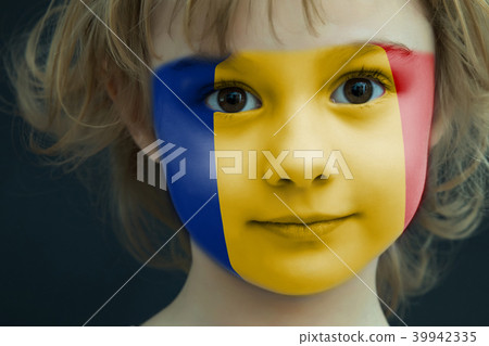 Portrait of a child with a painted Romanian flag Portrait of a child with a painted Romanian flag 39942335