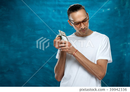 Cute man posing on blue background 39942336