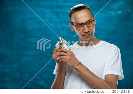 Cute man posing on blue background Cute man posing on blue background 39942338