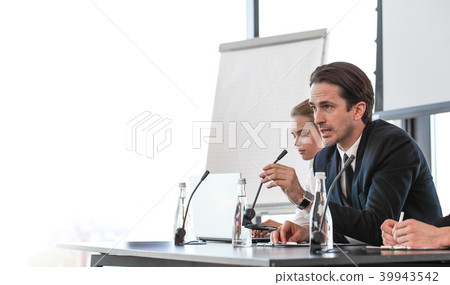 Speakers at business meeting Speakers at business meeting 39943542