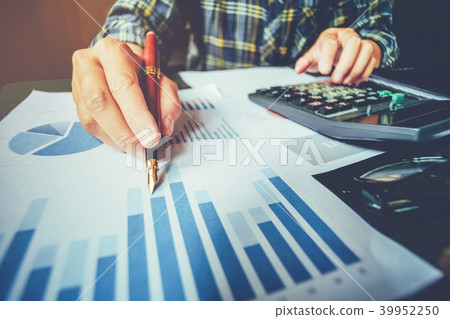 Business man with Report chart in office planning Business man with Report chart in office planning 39952250