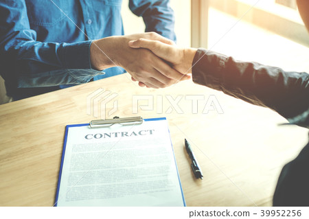 Business people negotiating a contract handshake Business people negotiating a contract handshake 39952256