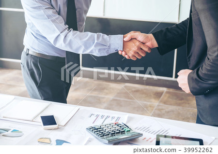 Business people colleagues shaking hands meeting 39952262