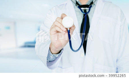 Doctor holding a stethoscope on background Doctor holding a stethoscope on background 39952265
