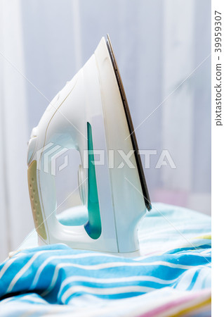 Photo of iron on striped fabric Photo of iron on striped fabric 39959307