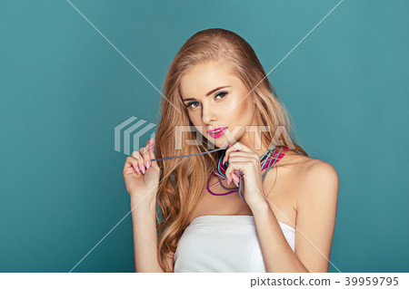 blond woman over blue background blond woman over blue background 39959795