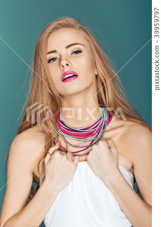 blond woman over blue background 39959797