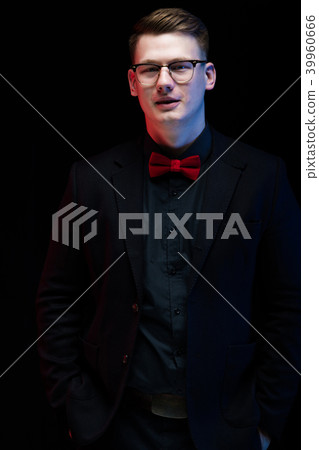 Portrait of confident handsome thoughtful elegant responsible businessman on black background Portrait of confident handsome thoughtful elegant responsible businessman on black background 39960666
