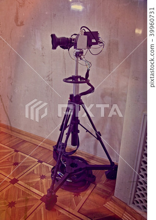 Video camera on a tripod Video camera on a tripod 39960731