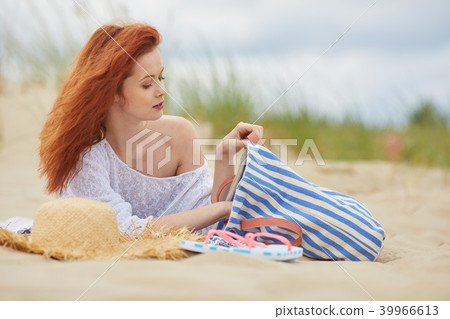 Young woman on sand to beautiful beach, Baltic Sea, Poland Young woman on sand to beautiful beach, Baltic Sea, Poland 39966613