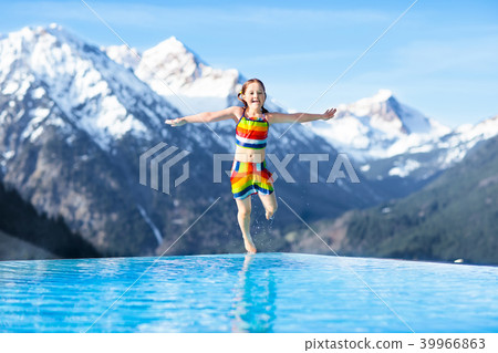 Child in outdoor swimming pool of alpine resort Child in outdoor swimming pool of alpine resort 39966863