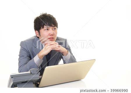 A businessman with a tired expression A businessman with a tired expression 39966990