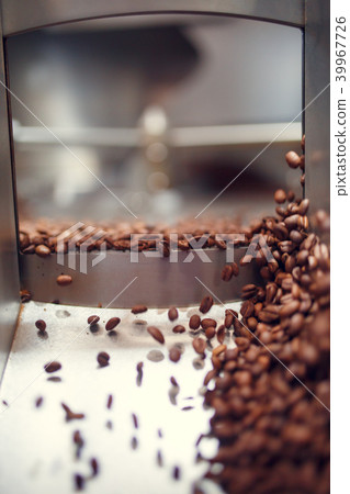 Picture of falling roasted coffee beans from roaster Picture of falling roasted coffee beans from roaster 39967726