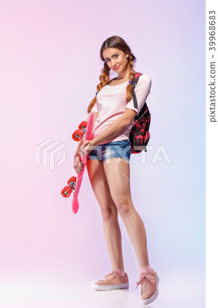 beautiful woman with skate in studio 39968683